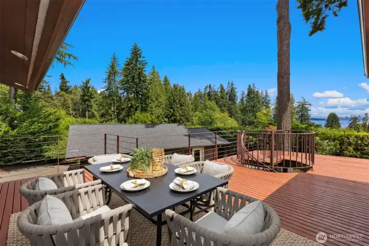 Relax on the deck, then follow the spiral staircase down to the private backyard.