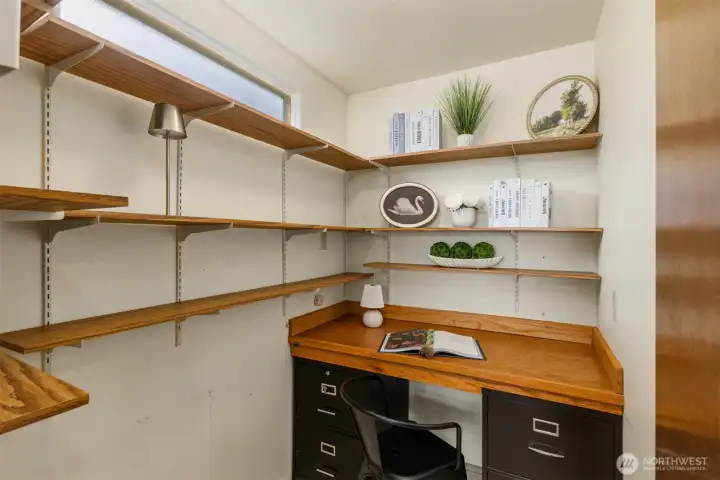 The walk-in pantry includes convenient office space and lots of storage.
