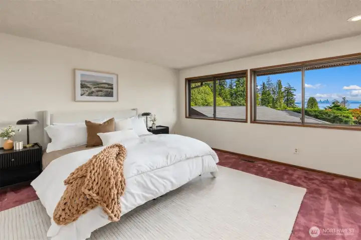Wake up to stunning views in the large, main floor primary bedroom.