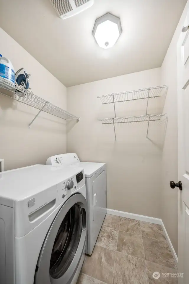 Laundry room with washer and drywer that stays