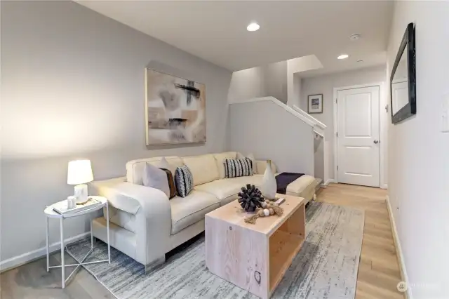 Lower level living area looking at the stairs.