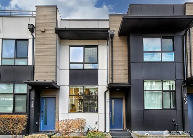 We love a floorplan where you walk into living space instead of at a stairwell. This living space is light and bright and open with high ceilings and large windows.