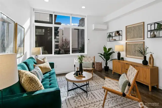 We love a floorplan where you walk into living space instead of at a stairwell. This living space is light and bright and open with high ceilings and large windows.