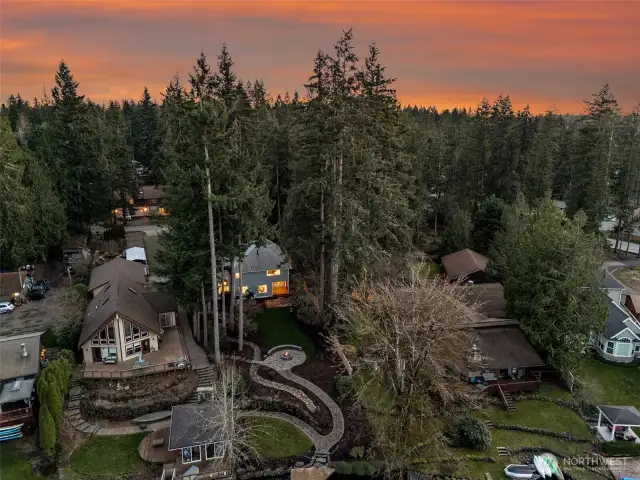 Placing the house closer to the street, and off the water front, provides for so much room to relax, entertain and play in the outdoor spaces!
