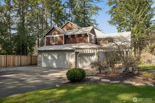 Oversized 3-car garage is great for your summertime water toys! Lots of off-street parking + room for smaller RV parking to the left of the garage pad.