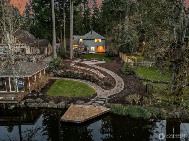 A Birdseye vision of all the opportunity for outdoor living - on Covington Creek with quick access to Lake Sawyer!  (boat house to the left belongs to the neighboring property)