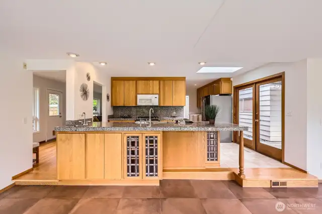 Big open floor plan kitchen with bar seating.