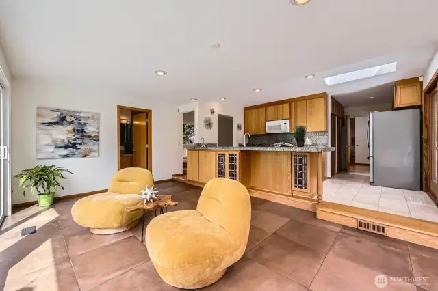 Step from kitchen into entertaining area