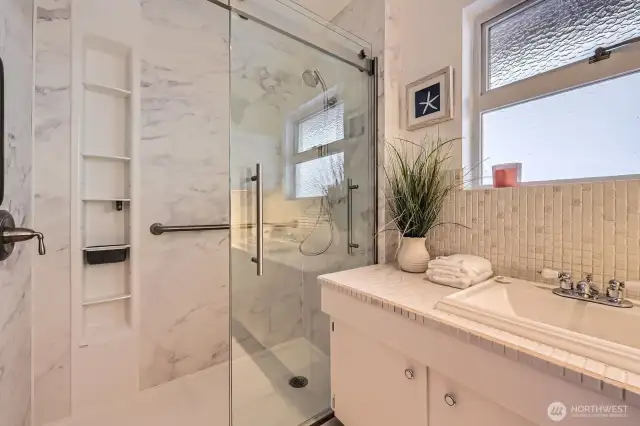 Big bright bathroom just off the bedroom hallway.