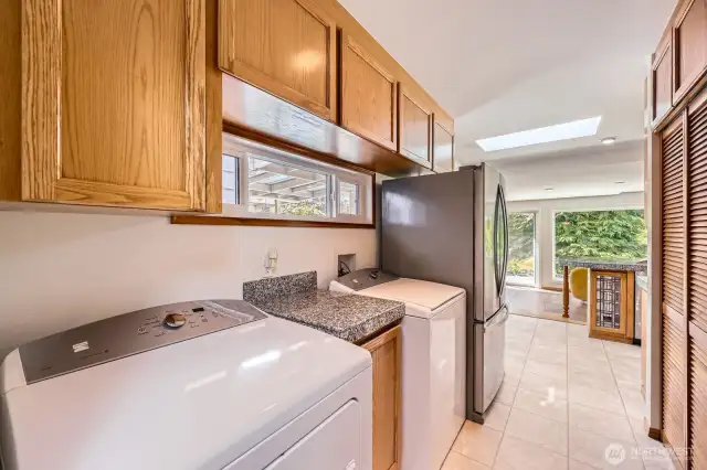 Practically located utility room area just around the corner from the kitchen.