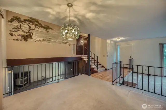 Dining room area connects to most of the home - downstairs is rec room area with gas fireplace, upstairs are bedrooms and bathrooms and behind the photo is the kitchen.