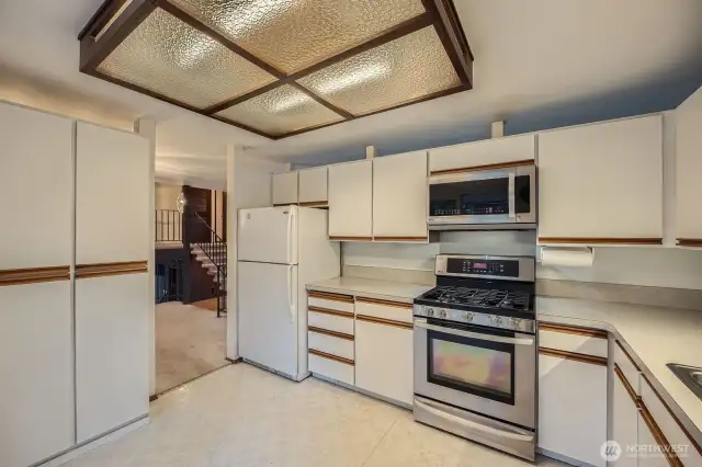 Storage pantry cabinets to the left and enough room for a small table.