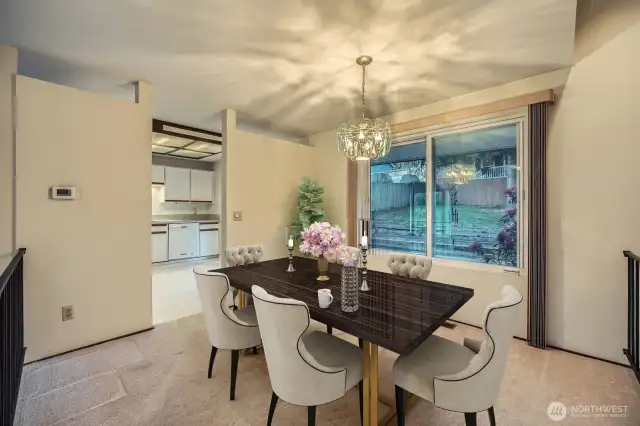 Dining room area connects to kitchen and has a nice view of the backyard. The double, double pain windows keep the air traffic noise out completely - once inside you don't hear anything outside!  *Photo is virtually staged.
