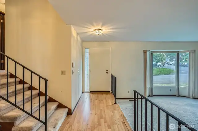 Entry to your new tri-level home in Des Moines! Step down living room to the right and stairs up to the bedrooms on your left.