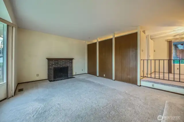 Bring your vision and paint brush to make this space work for you!! Behind paneled wall is the kitchen.