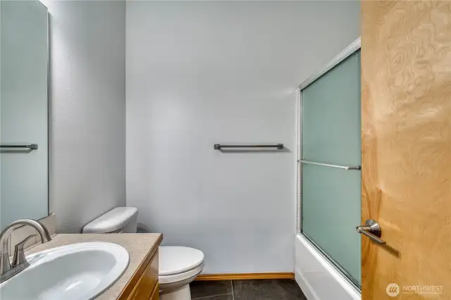 Mainfloor bathroom with tile flooring.