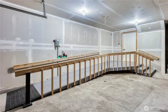 New Wheelchair ramp for easy access into the home.  Garage is plenty large with ample room to park cars as well.