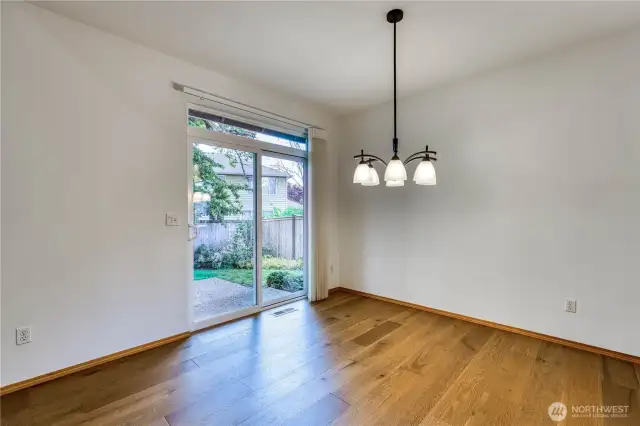 Beautiful engineered hardwood flooring thoughout most of the mainlevel.  Notice transom window for lots of light and new blinds.