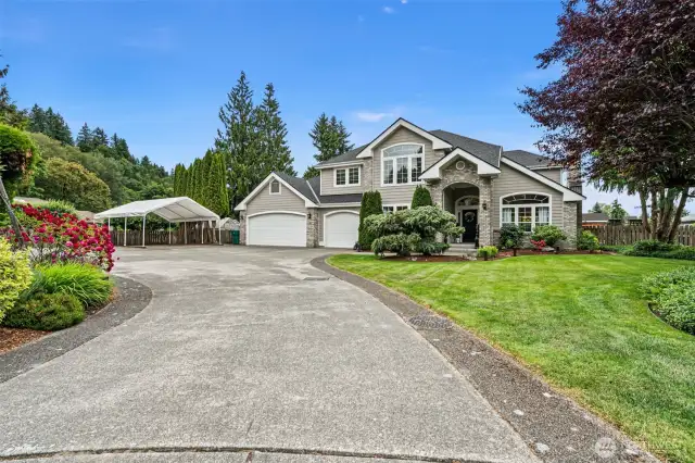 Plenty of parking- large garage, RV and extra gravel parking set back on cul-de-sac.