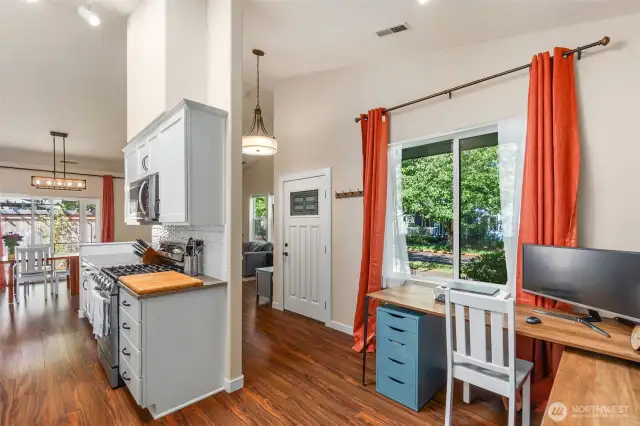Open layout, with front door leading to the living room on the right, bonus nook on the left.