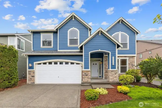 Beautifully landscaped front view of the property.