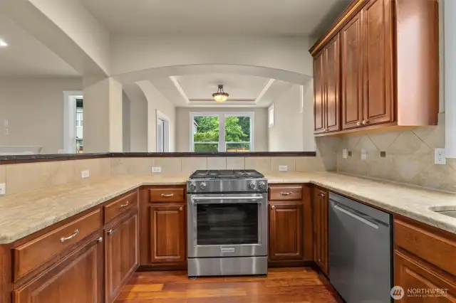 Kitchen with open view into living room and breakfast nook.