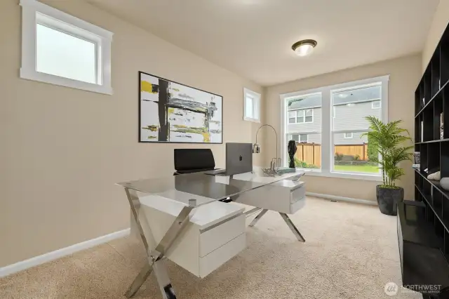 Virtually staged downstairs bedroom or optional office space.