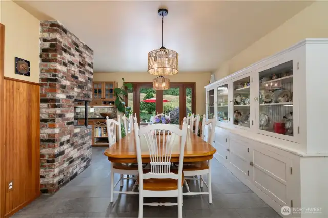 Step inside to entry and dining room just to the right. Vinyl tile flooring in dining and kitchen.