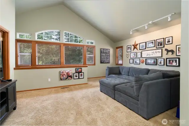 Vaulted ceilings and lots of natural light highlight the space.
