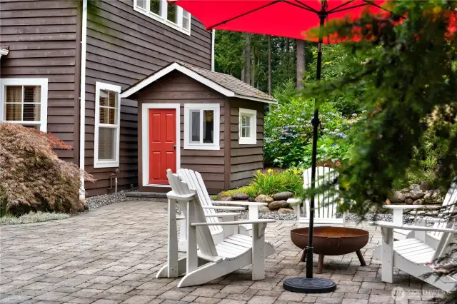 The playhouse is painted to match the main home and can even be plugged in to provide power and lighting!