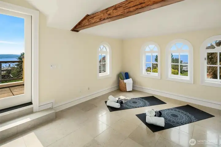 Third floor flex room – a perfect yoga room – with view windows and access to the rooftop deck.