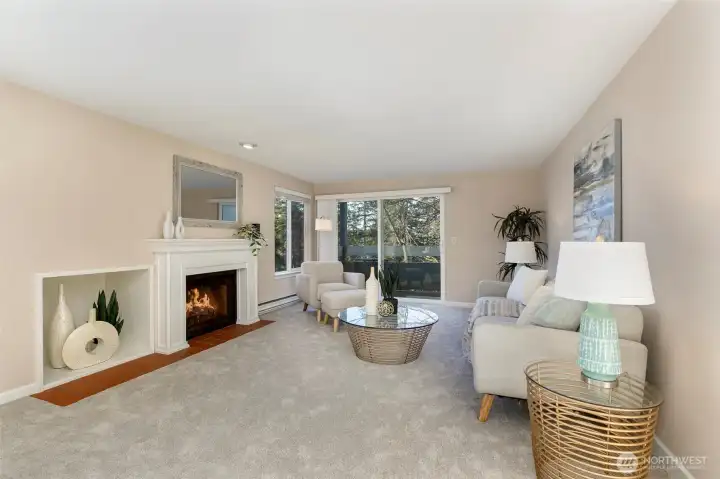 Step in to this cheerful, sunny home w/ custom mantled fireplace & large view deck