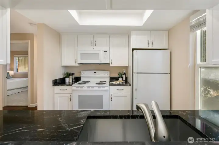 Marble counter tops, deep stainless sink & upgraded cabinetry