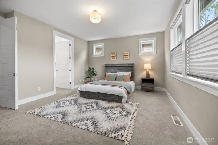 Clean, inviting bedroom space with room to spread out