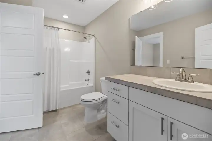 Full bathroom upstairs with two entrances