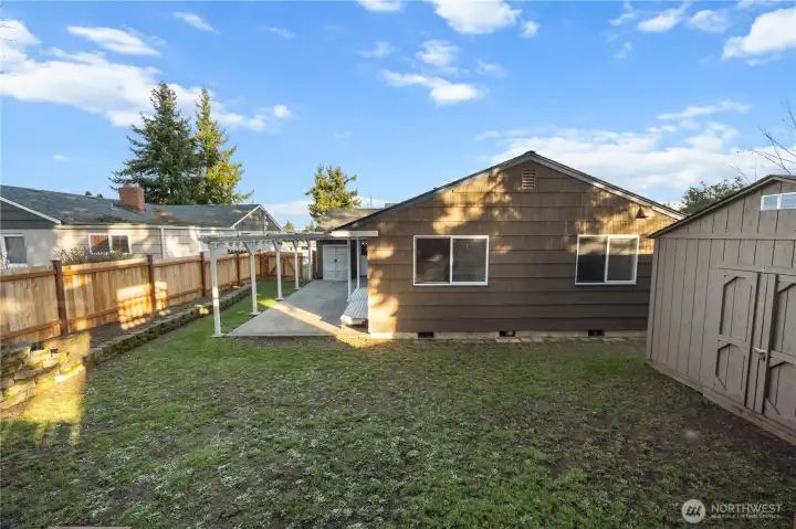 nice level backyard, the outbuilding shown is the largest of the 3 and has power, perfect for a shop
