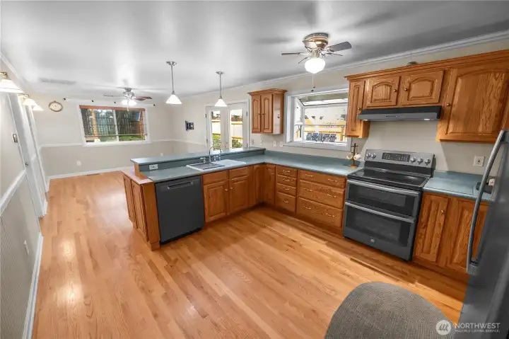 kitchen has great cabinet and storage space and a box window for plants