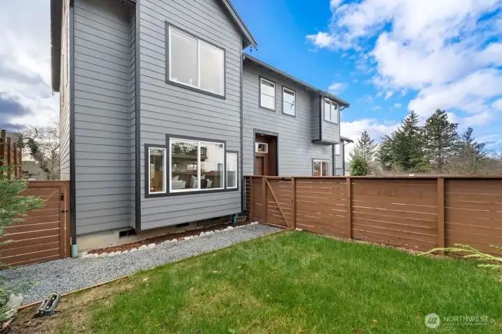 Grassy Fully fenced & gated wrap-around yard excellent for pets and playtime!