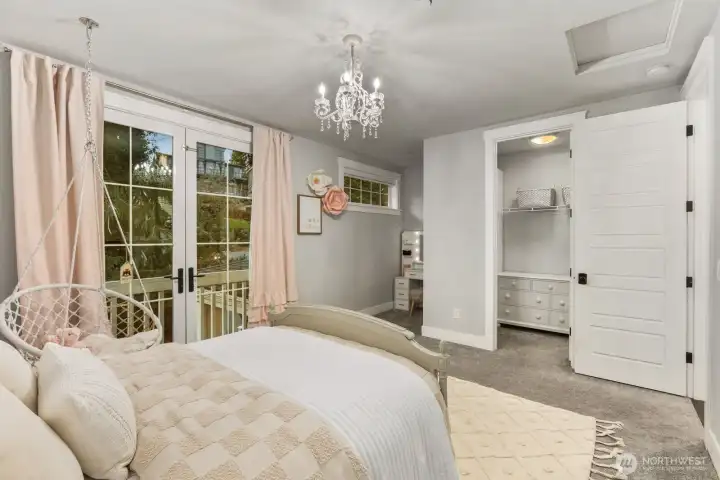 Third bedroom featuring a desk nook and walk in closet on upstairs floor