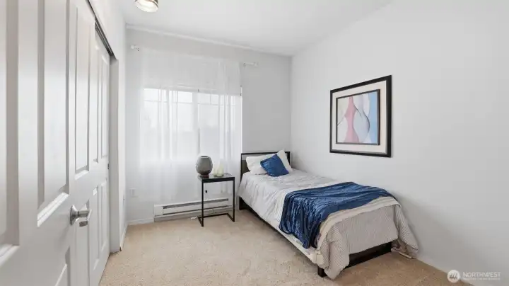Comfortable secondary bedroom perfect for guests, a home office, or flex space.