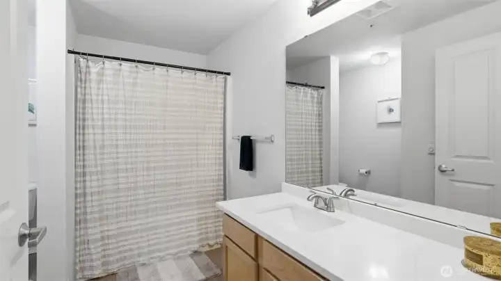 A thoughtfully designed guest bath offering both style and everyday convenience.