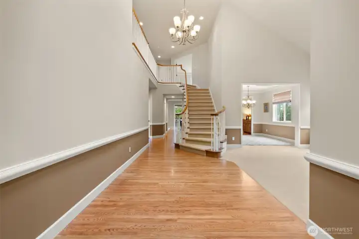 Vaulted ceilings and hardwood floors make for a grand entry