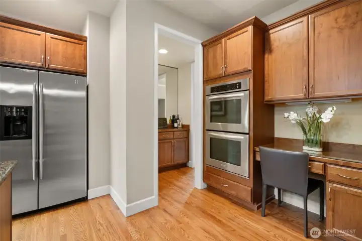 Double ovens and a built-in desk where you can set up your recie books
