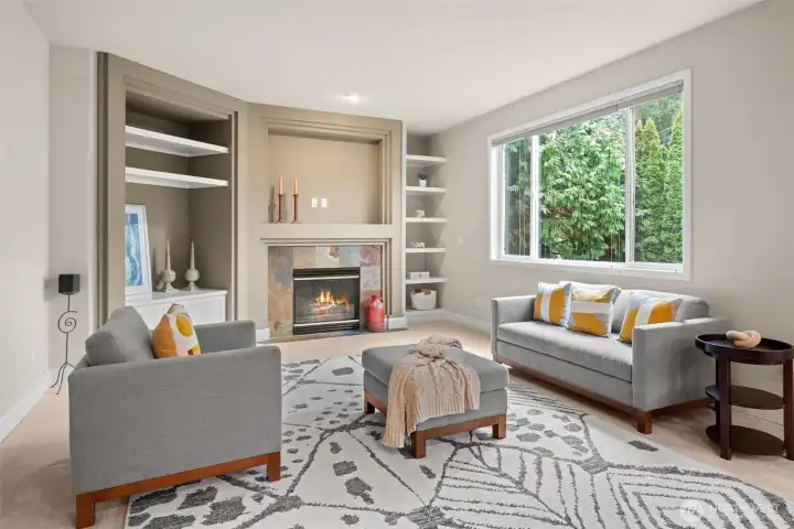 Another gas fireplace with built-ins in the family room off the kitchen