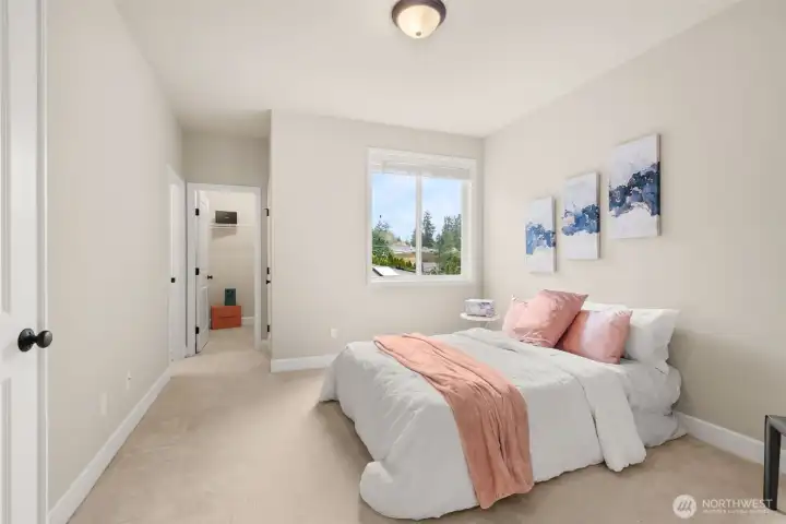 Mother-in-law or guest suite on the main level with walk-in closet and personal bathroom.