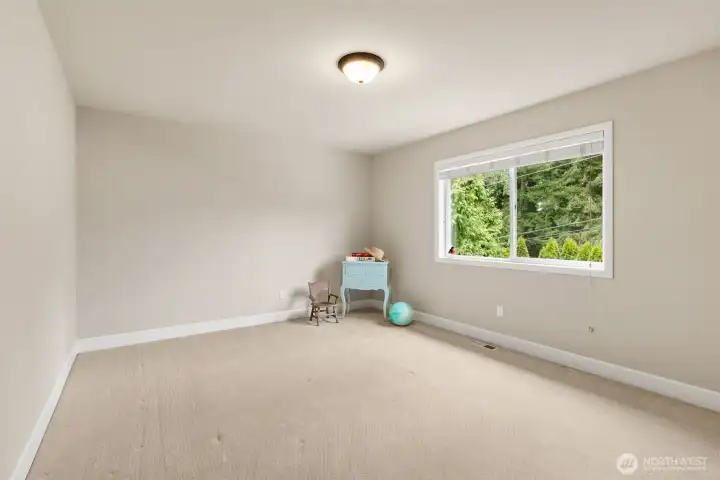 1 of 3 secondary bedrooms on the upper level