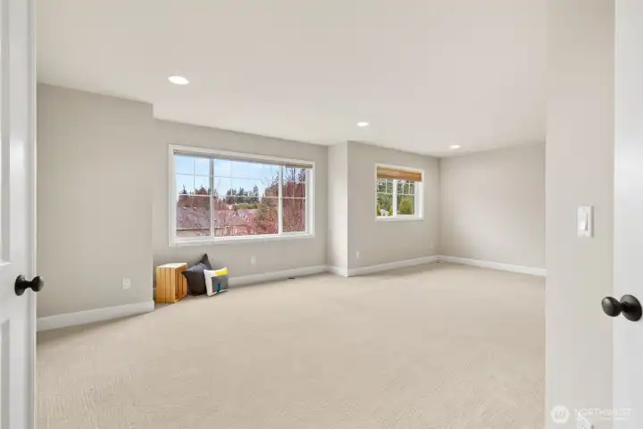 Double-door entry into the huge multi-purpose bonus room on the upper level