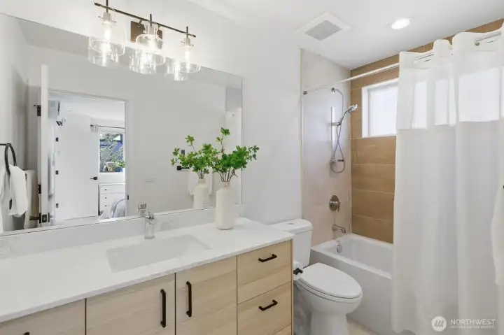 The Primary bath offers a large vanity, modern hardware and nice craftsmanship.