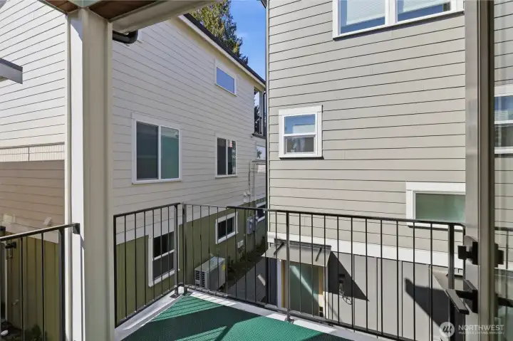 Open your door from your Great Room for fresh air. This sweet patio could host your bistro table, or head around the corner to rooftop deck!
