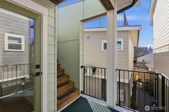 A view of the stairs leading to the rooftop deck.